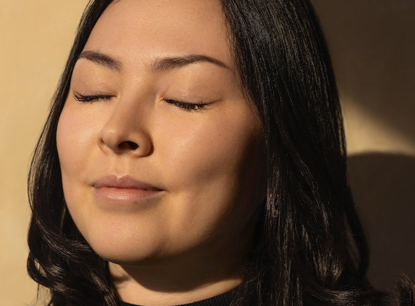 woman closing her eyes