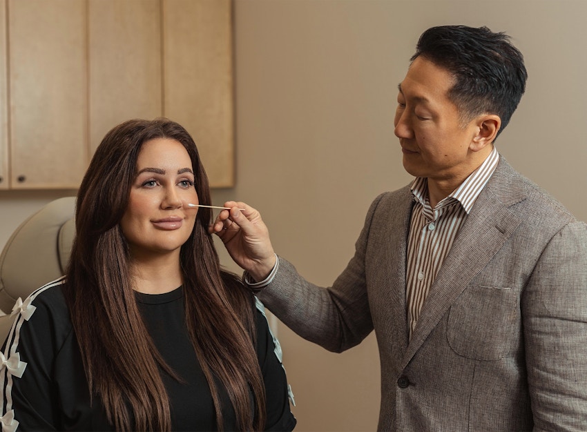 doctor looking at a patients face