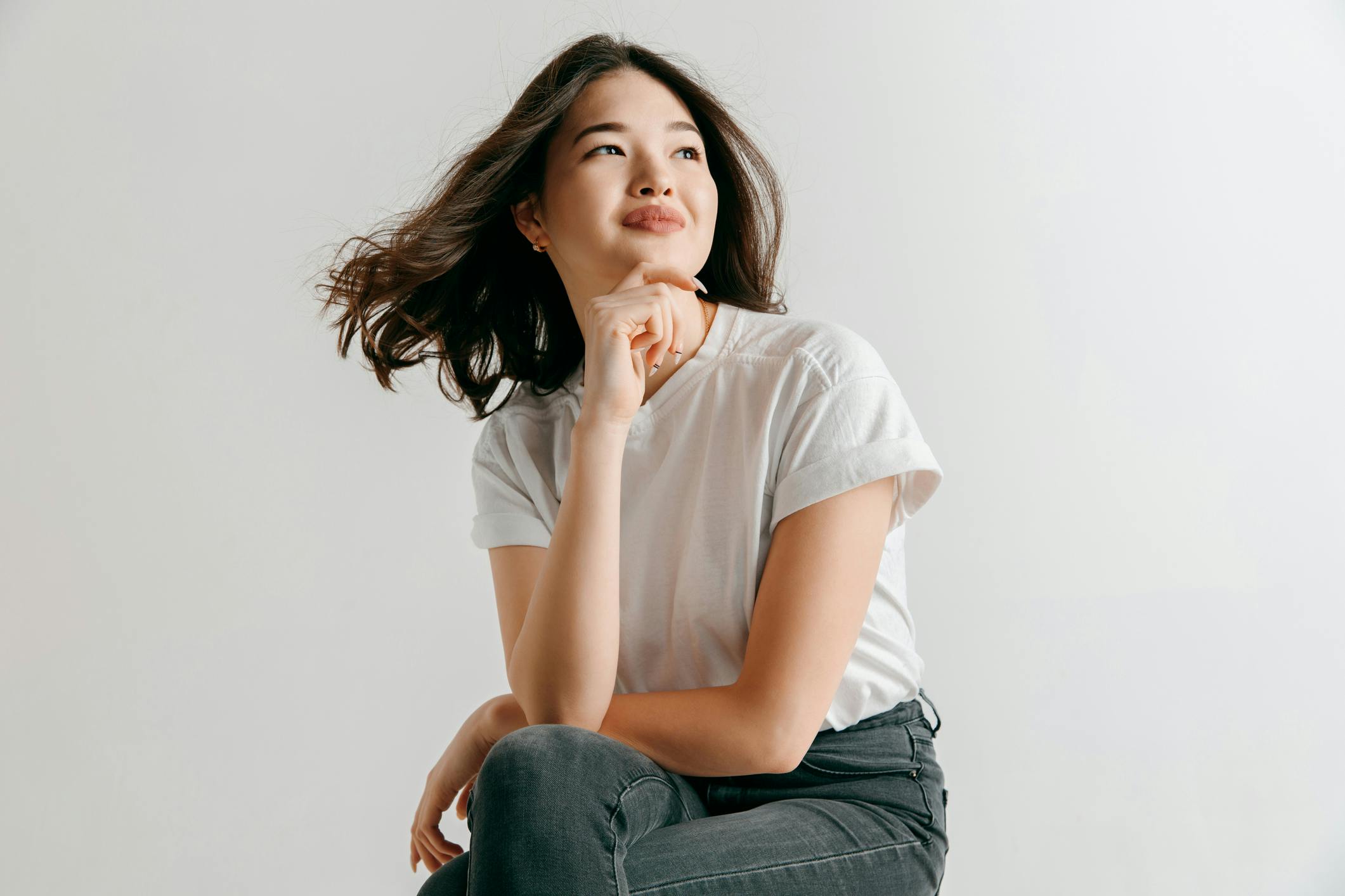 woman in white shirt and jeans