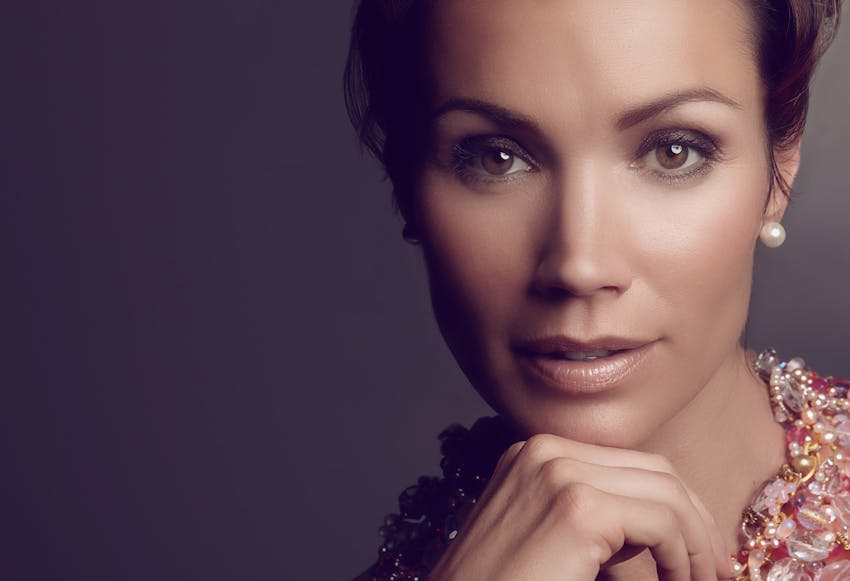 Woman with her hand on her chin