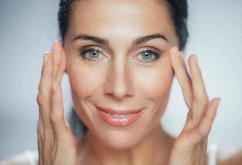 woman touching her eyes
