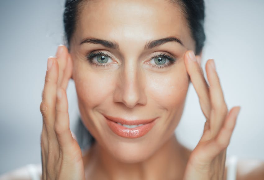 woman touching her eyes