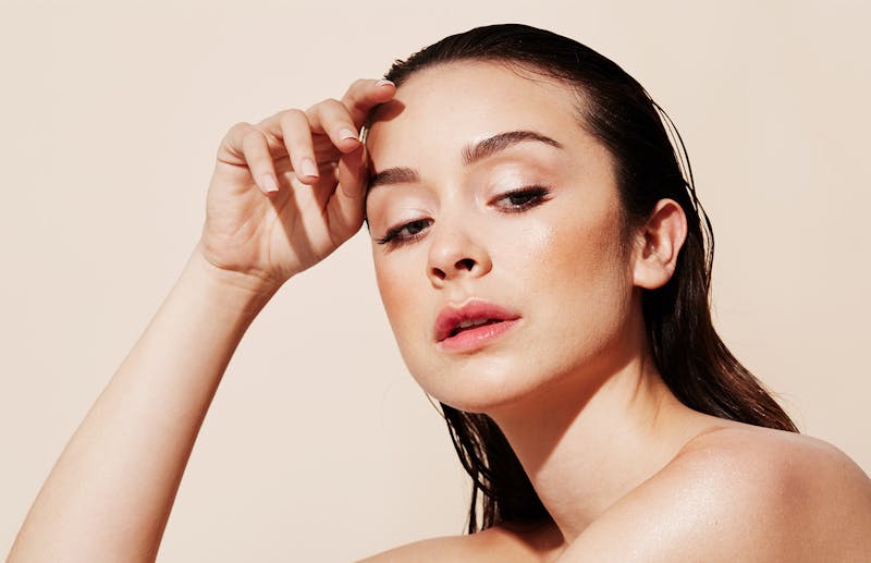 Woman touching her face