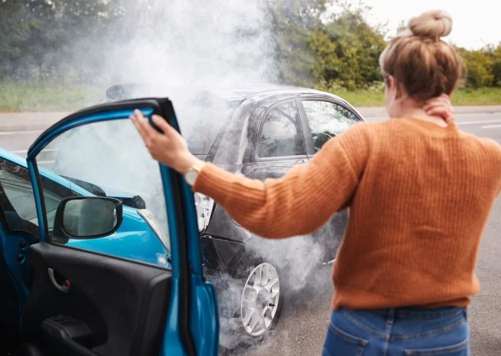 Fatal Car Accident Two cars smoking after an accident