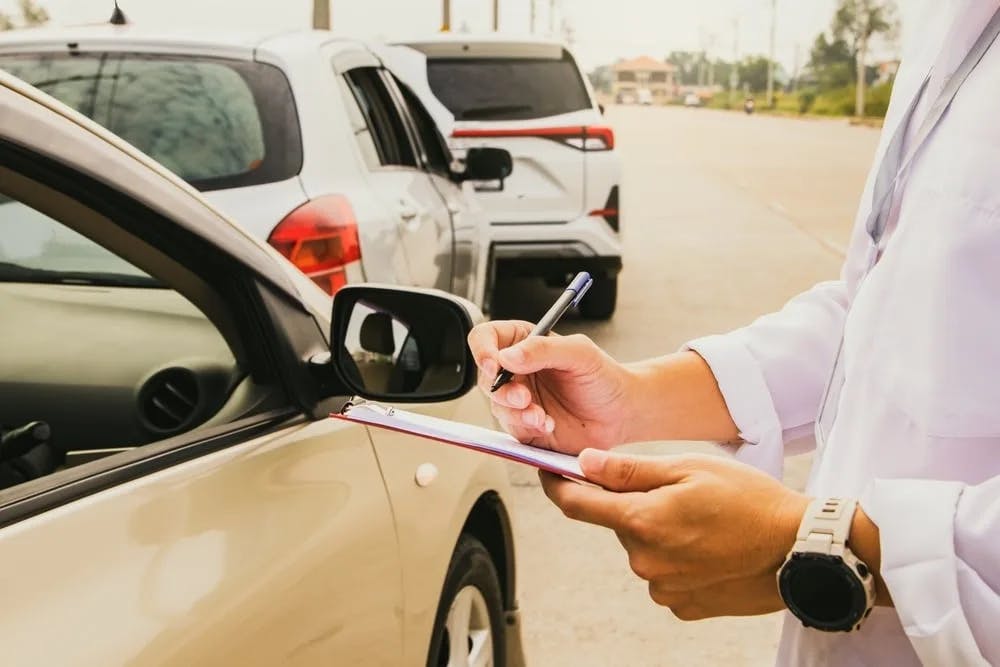 Car Accident Inspector Car accident inspector gathering incident details