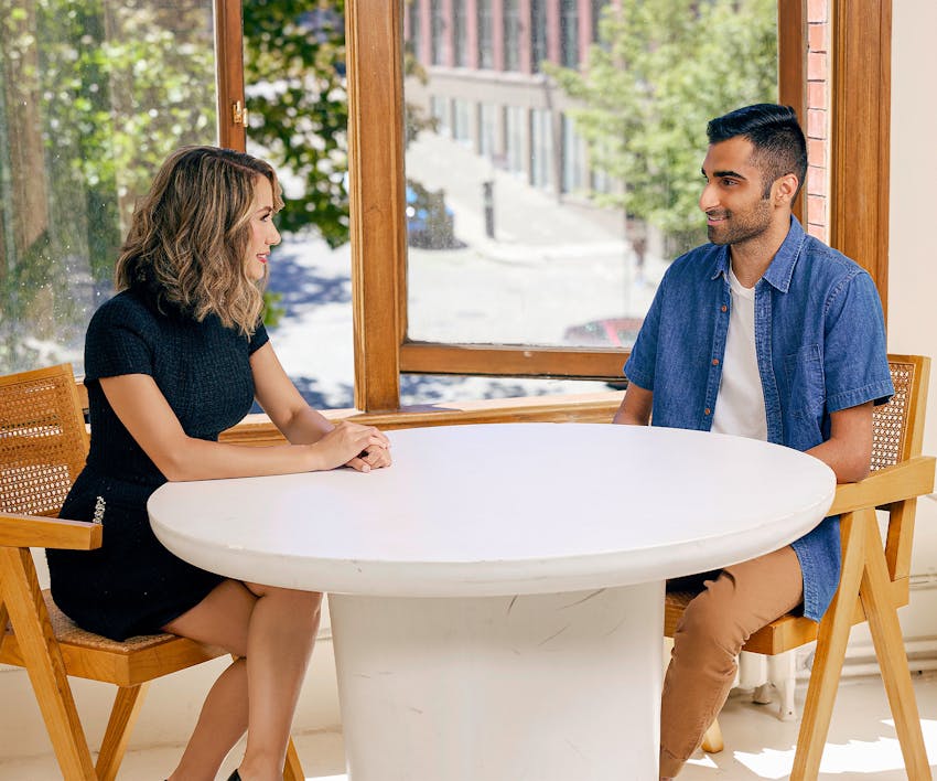 two people talking at a table