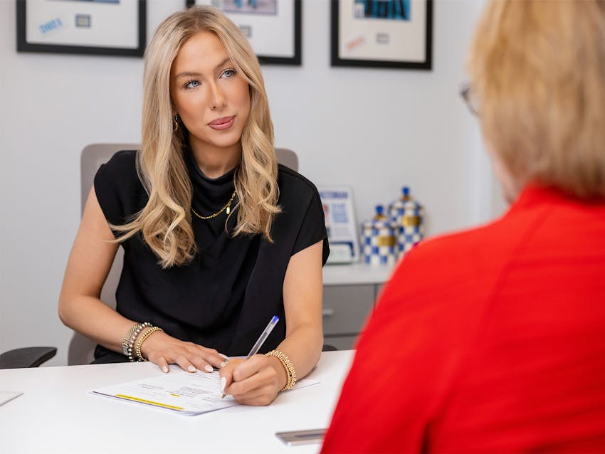 Woman filling out paperwork