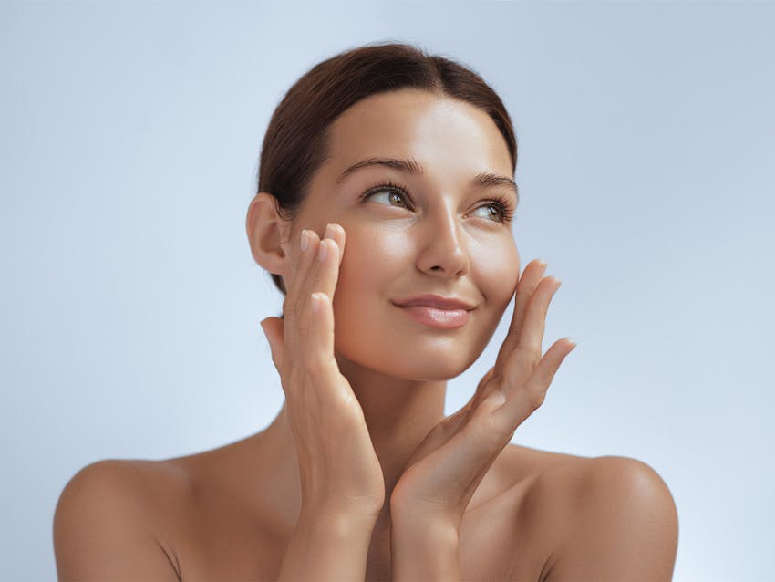 Woman touching her face