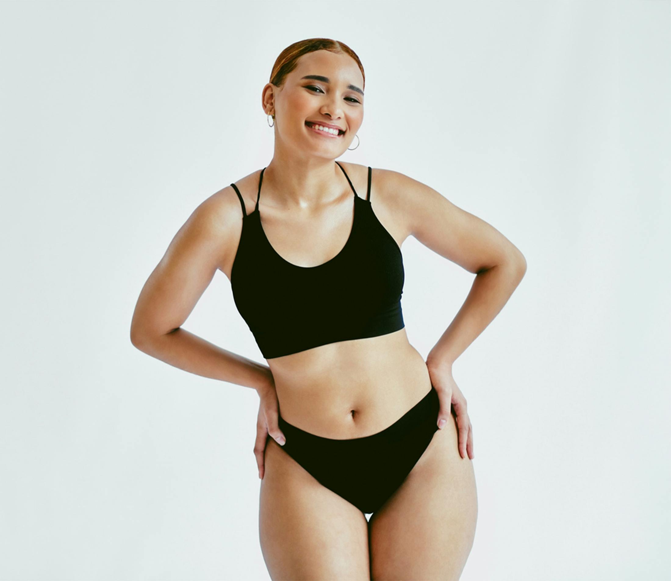 A woman posing with her hands on her hips
