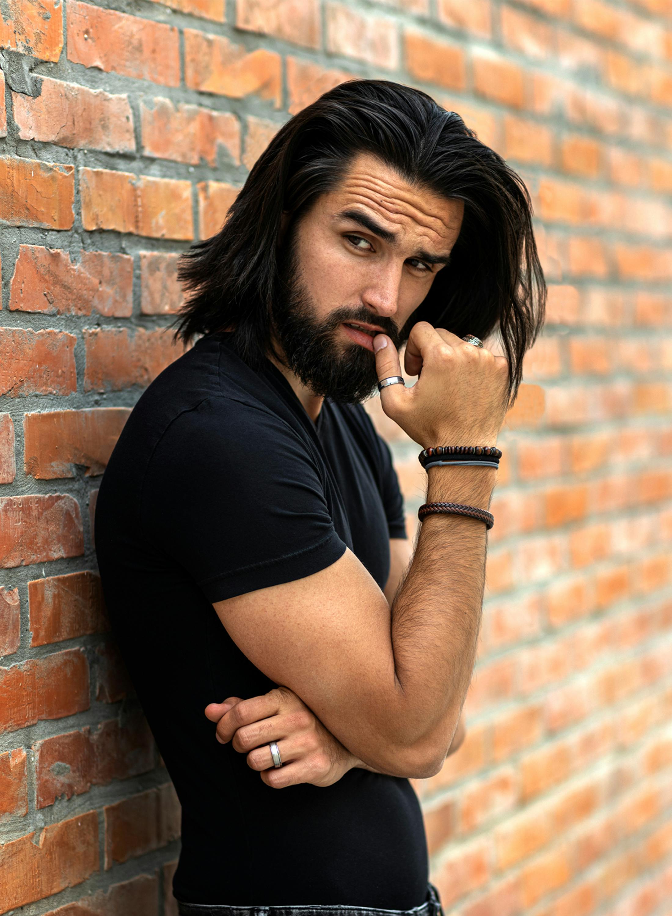 man leaning against wall