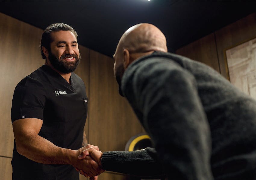 doctor and patient shaking hands