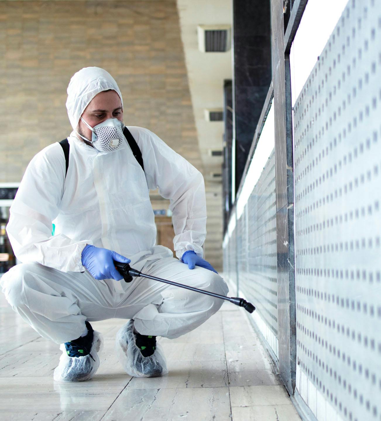Person spraying the floor