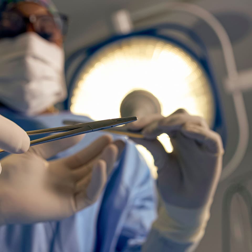 Doctors holding surgical instruments