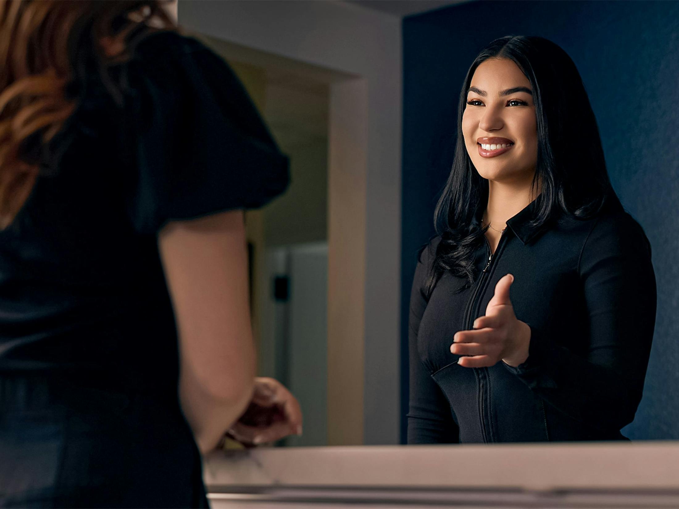 Woman smiling and going to shake hands