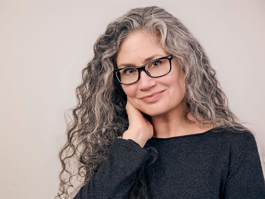Woman with glasses smiling