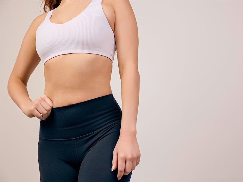 A woman in a sports bra