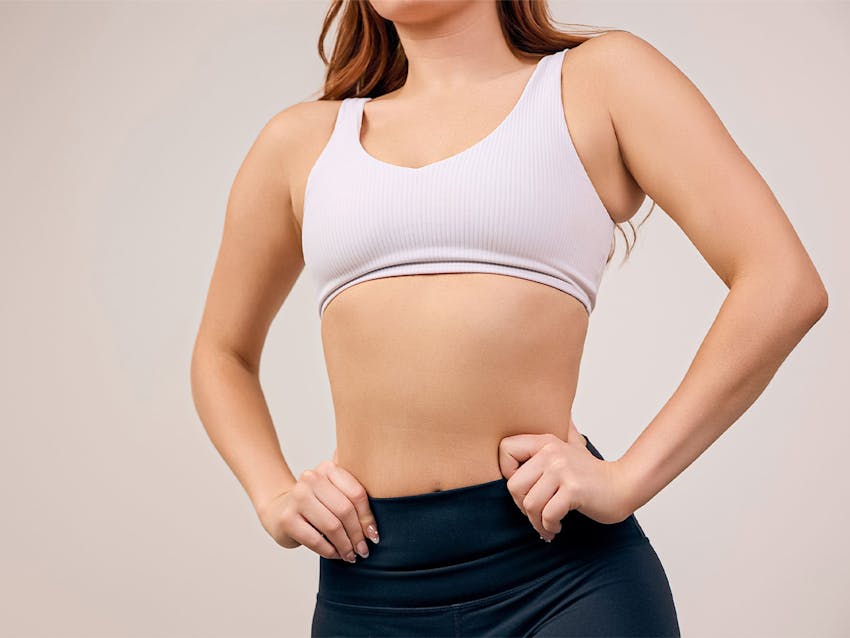 A woman in a sports bra