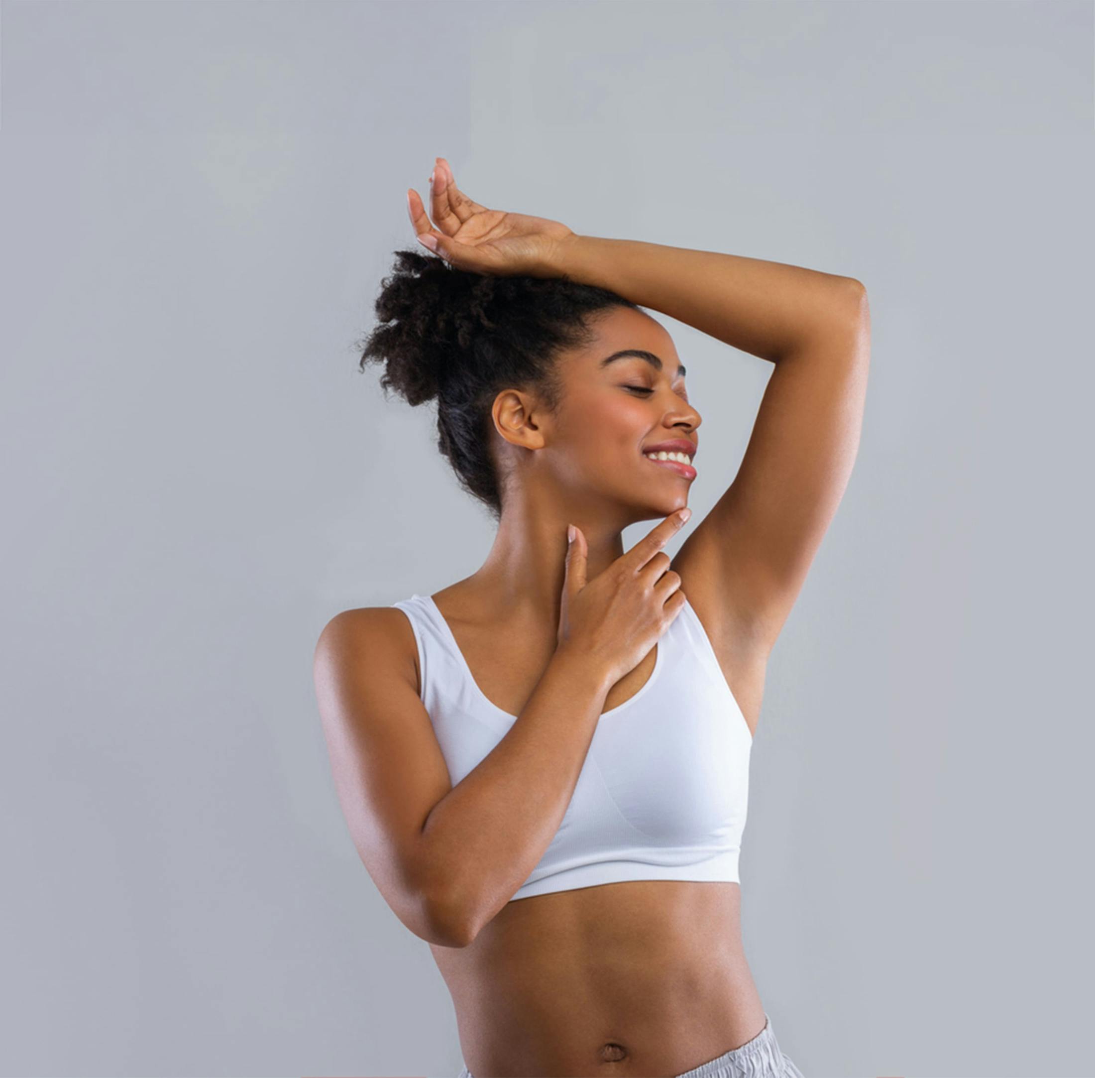 Woman smiling with arms up