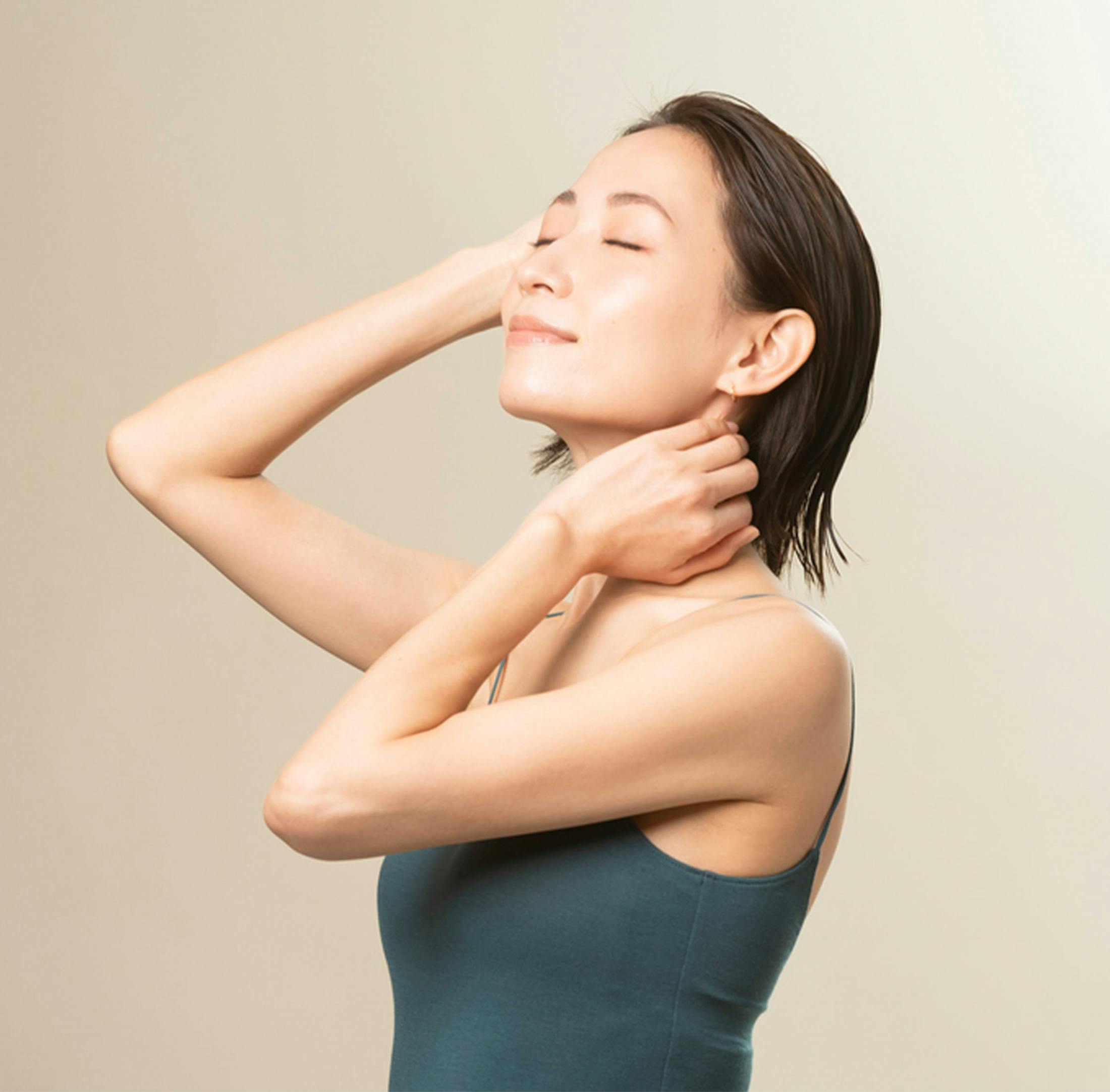 Woman smiling with her eyes closed