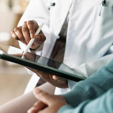 doctor with ipad