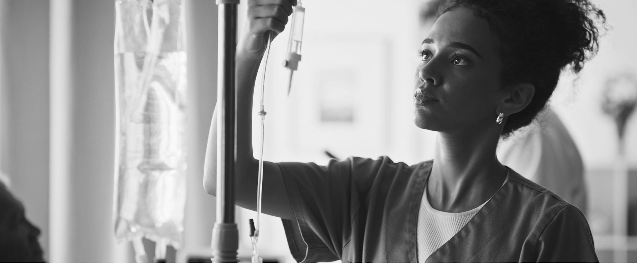 nurse with iv bag