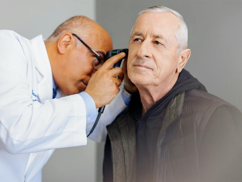 doctor looking in patients ear