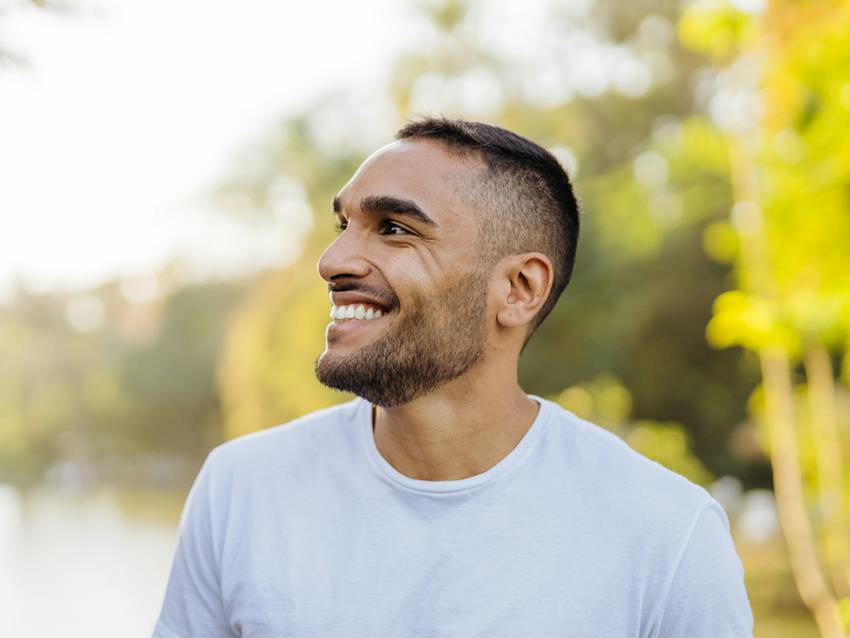 man smiling looking over shoulder