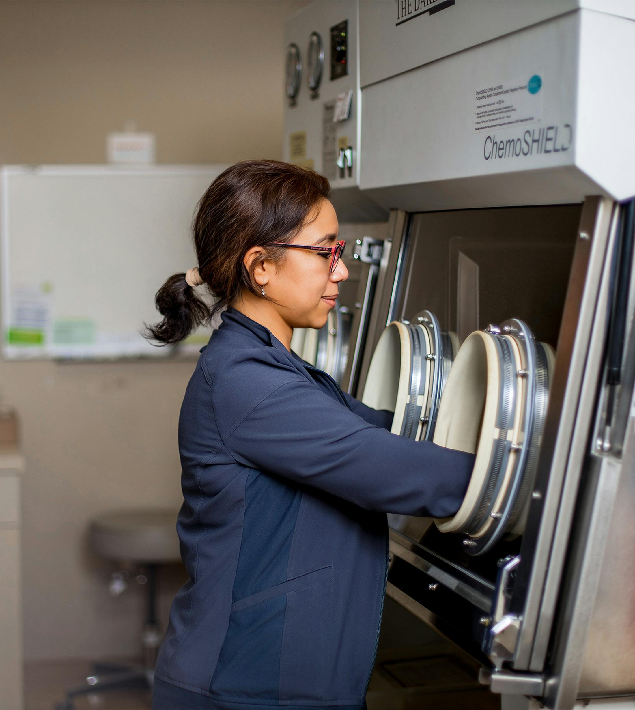 woman with hands in machine
