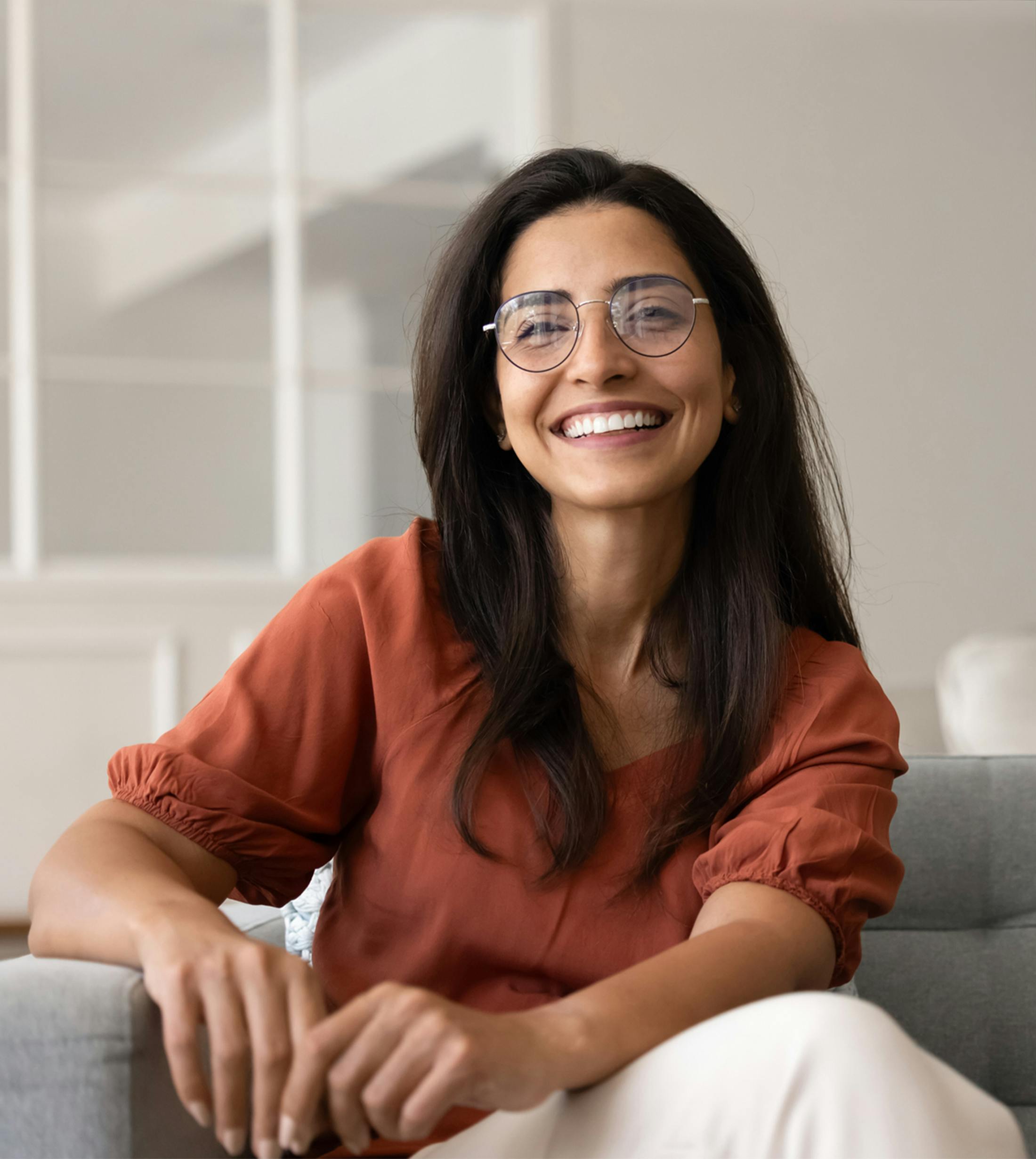 woman smiling on couch