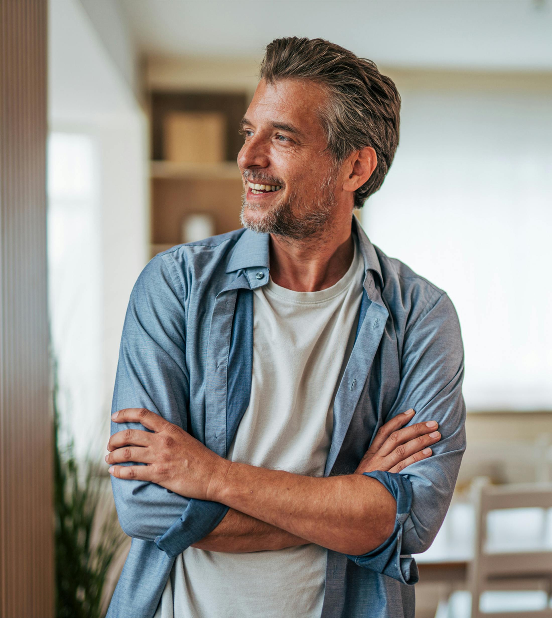 man looking over with arms crossed