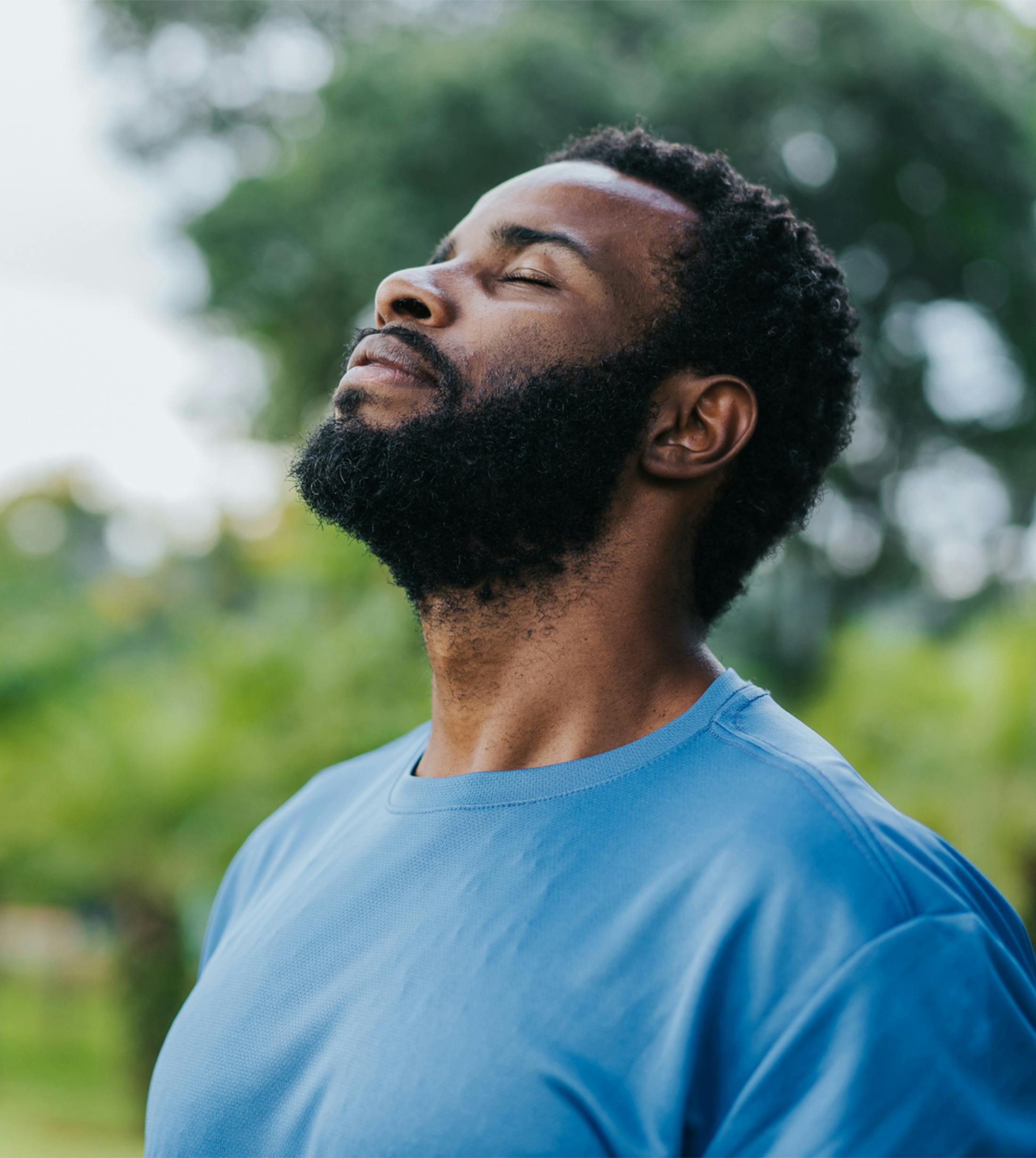 man with eyes closed and head tilted up