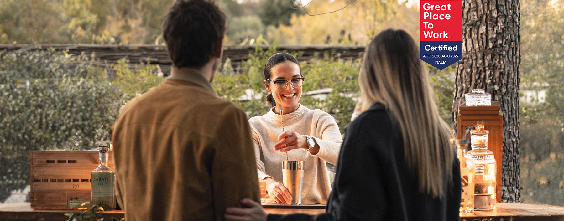 Woman Making Cocktails for Couple at Tenuta Toscana
