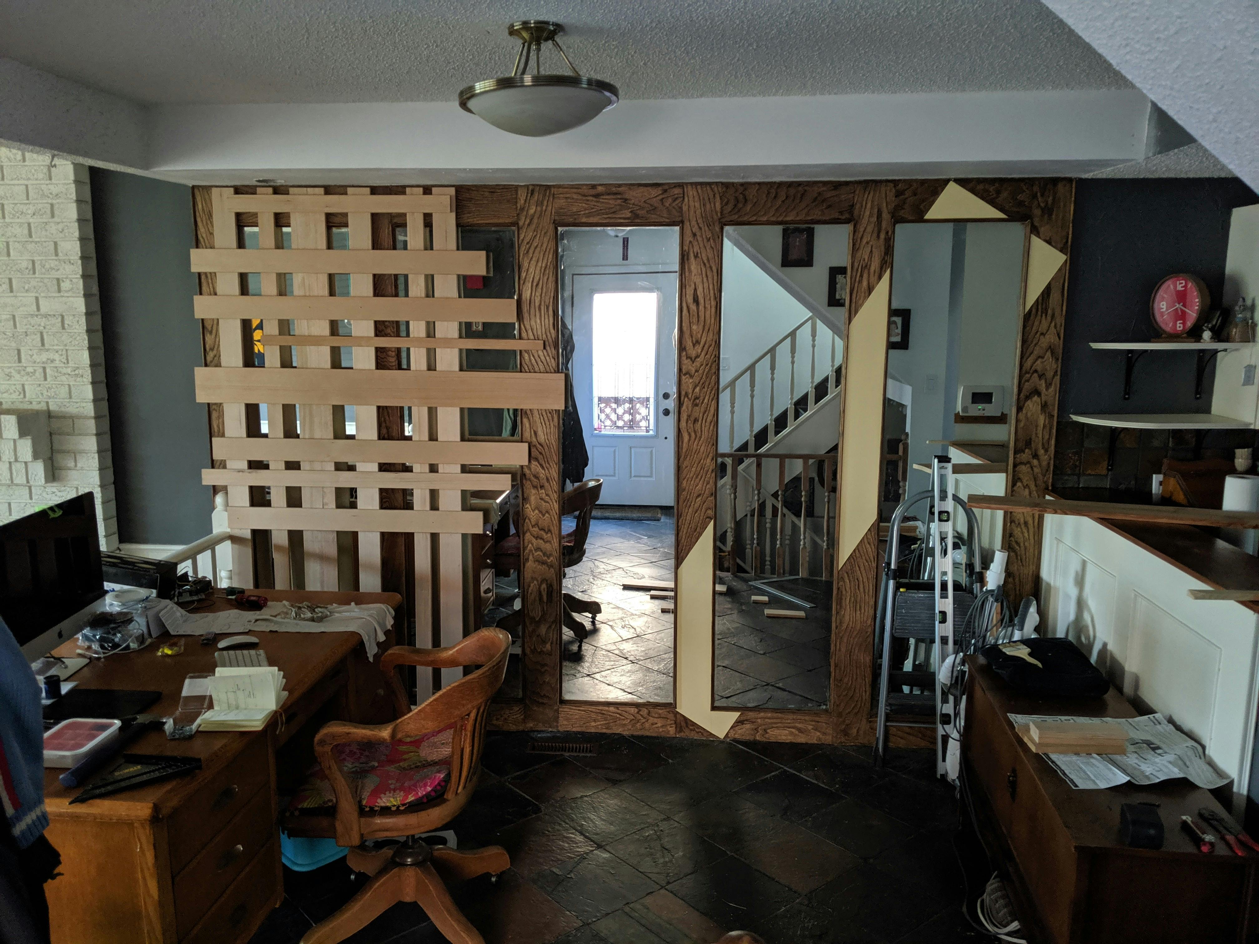 Wall stained, painted and dry fitting shelf backing. The angle of everything follows the staircase in the reflection.