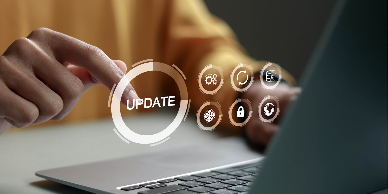 Laptop displaying an update message representing the modernization and integration of legacy business systems