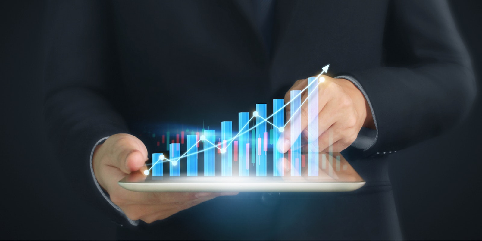 Graphic showing a person holding a tablet with a rising bar chart, symbolizing business growth and embedded integration capabilities for SaaS companies.