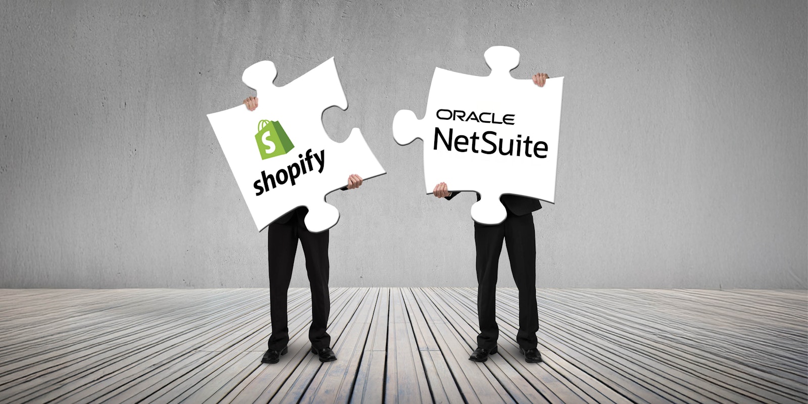 blog photo 1Graphic showing two people holding large puzzle pieces labeled Shopify and NetSuite, symbolizing seamless data exchange and automated business workflows.
