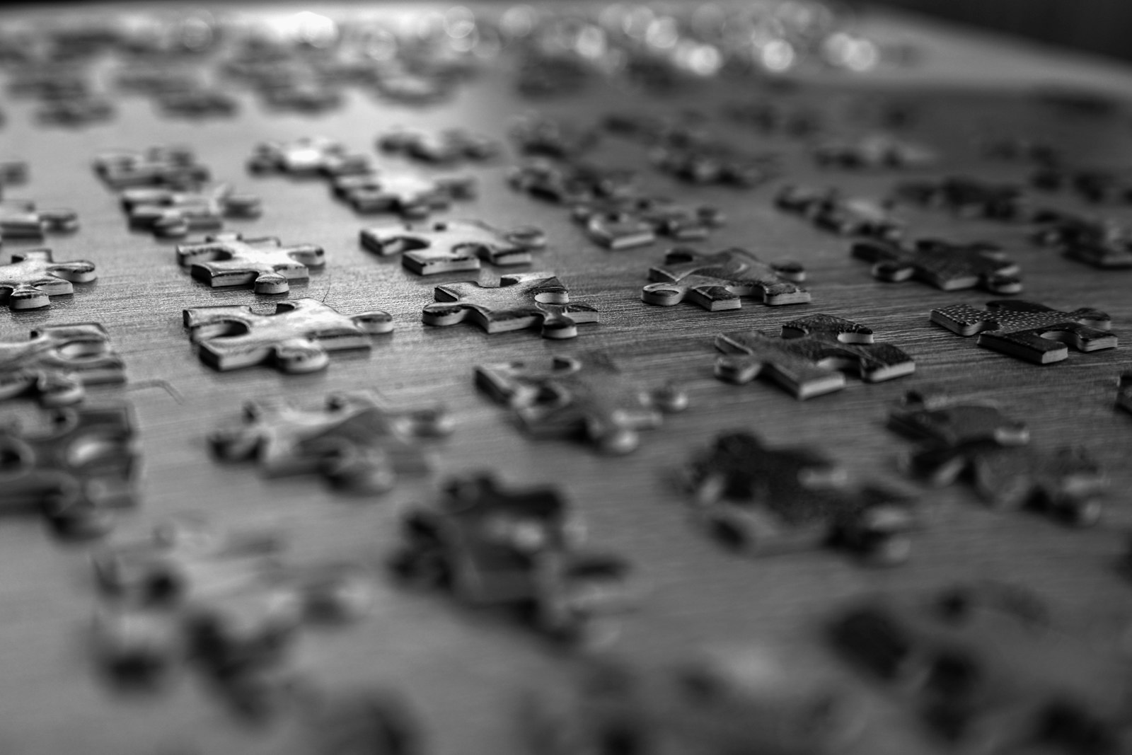 Dark puzzle pieces spread apart