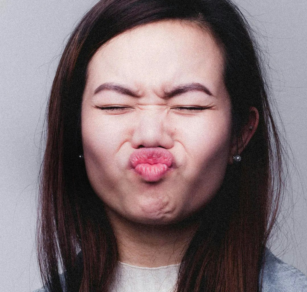 Image of a woman making a scrunched-up expression