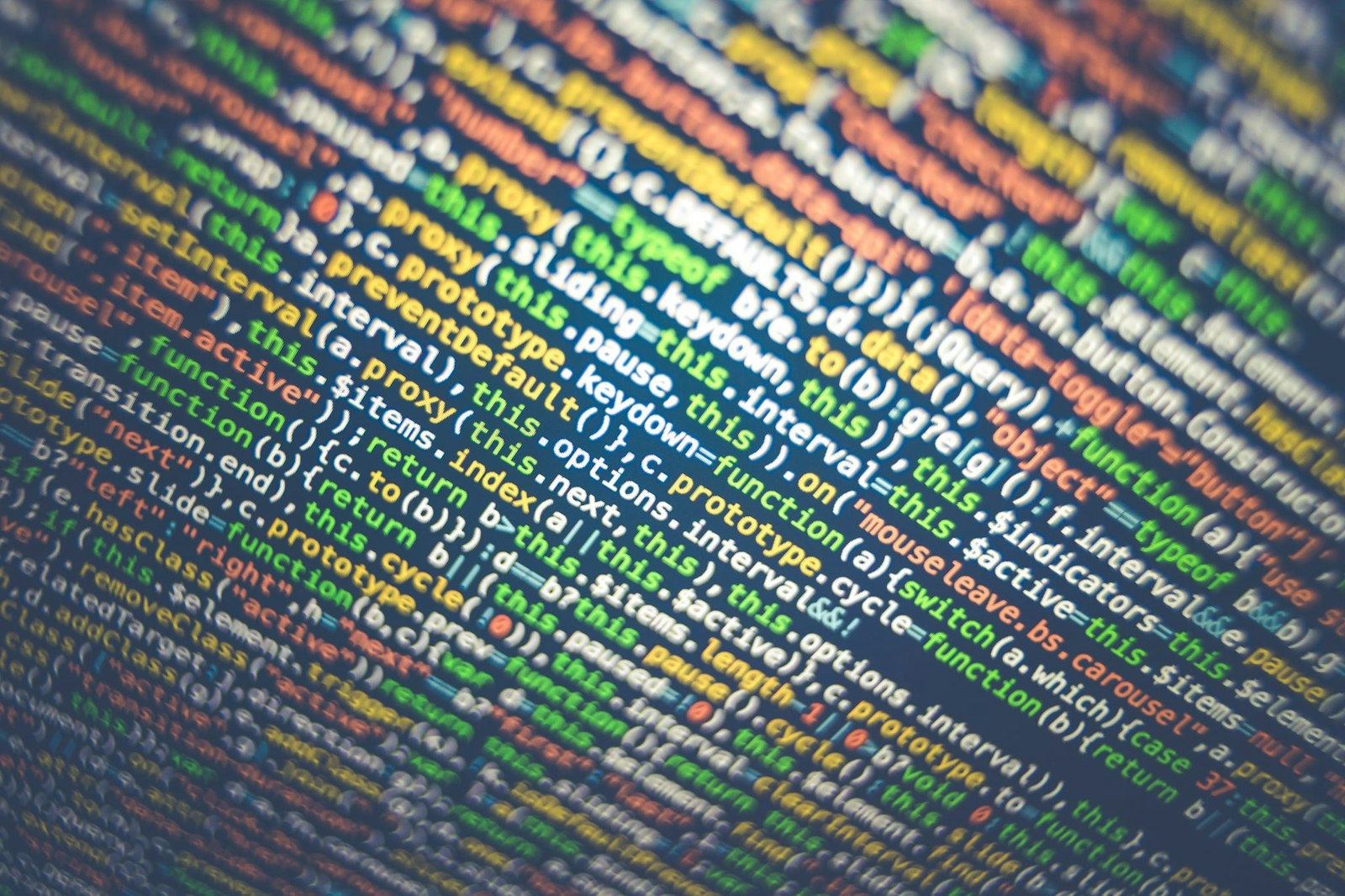 Technology graphic featuring code on a screen, representing API management, integration platforms, and software connectivity.