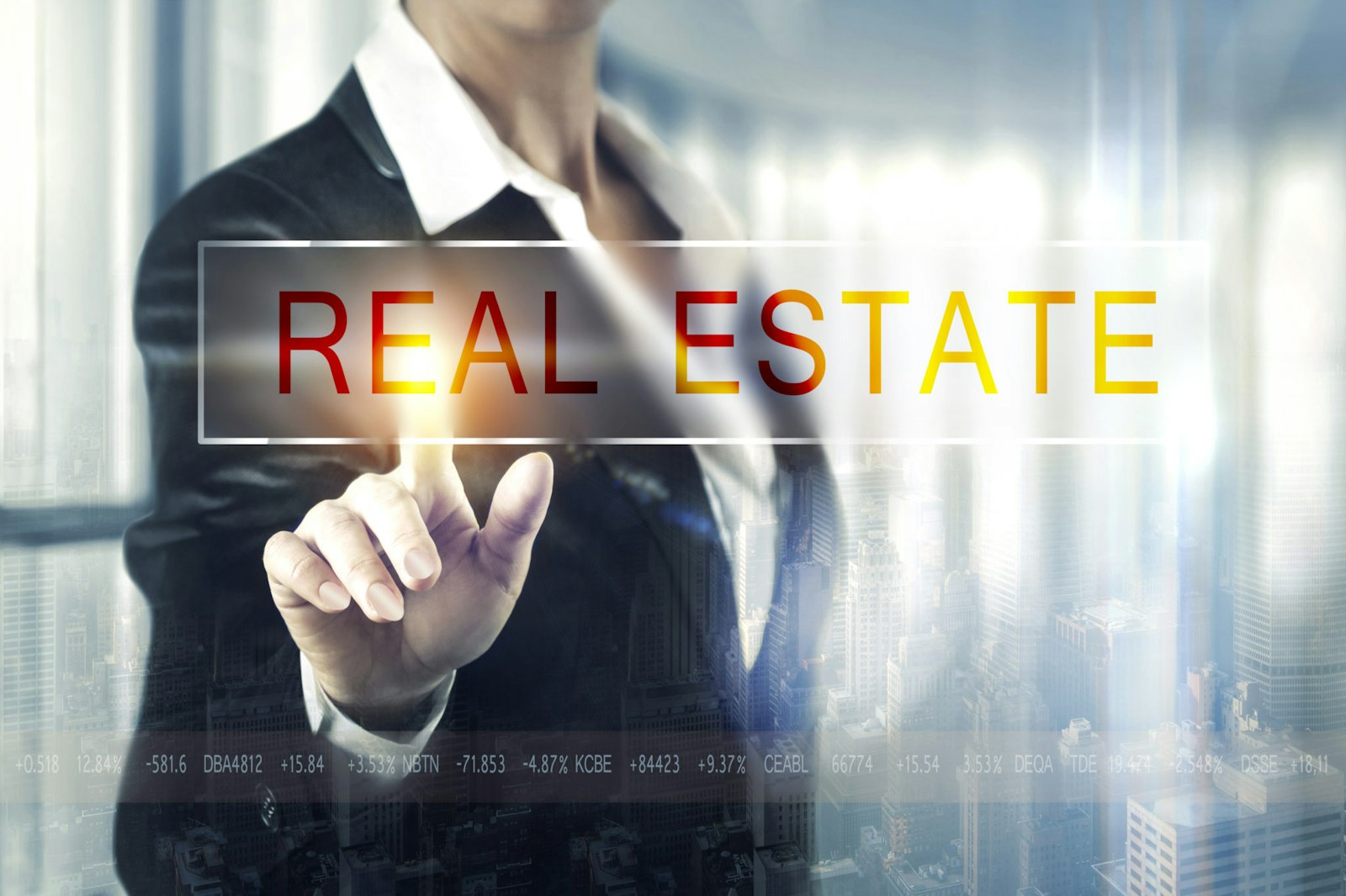 Alt Text: Graphic featuring a man pointing to "Real Estate," symbolizing RETS connectivity and data integration for real estate applications.