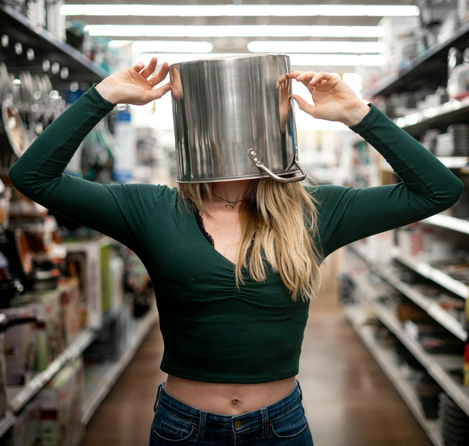 Image of a woman carrying a large pot on her head, representing the shift toward convenient home grocery delivery and new fulfillment models.
