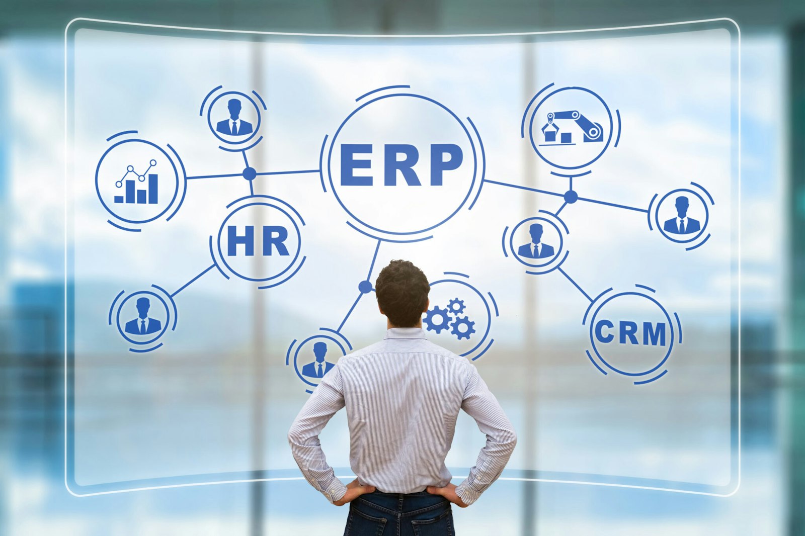 Illustration of a man viewing a large screen with ERP in the center and connected business icons branching out, representing integration software providers and connected systems.