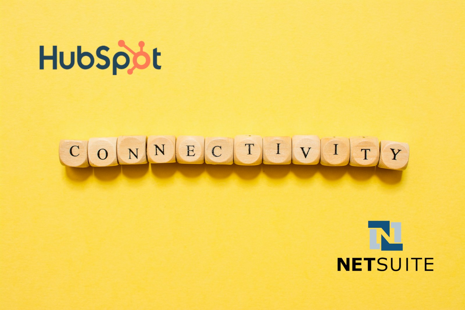 Graphic featuring the HubSpot logo at the top, the NetSuite logo at the bottom, and letter blocks spelling "Connectivity" in the middle, representing seamless CRM and ERP integration.