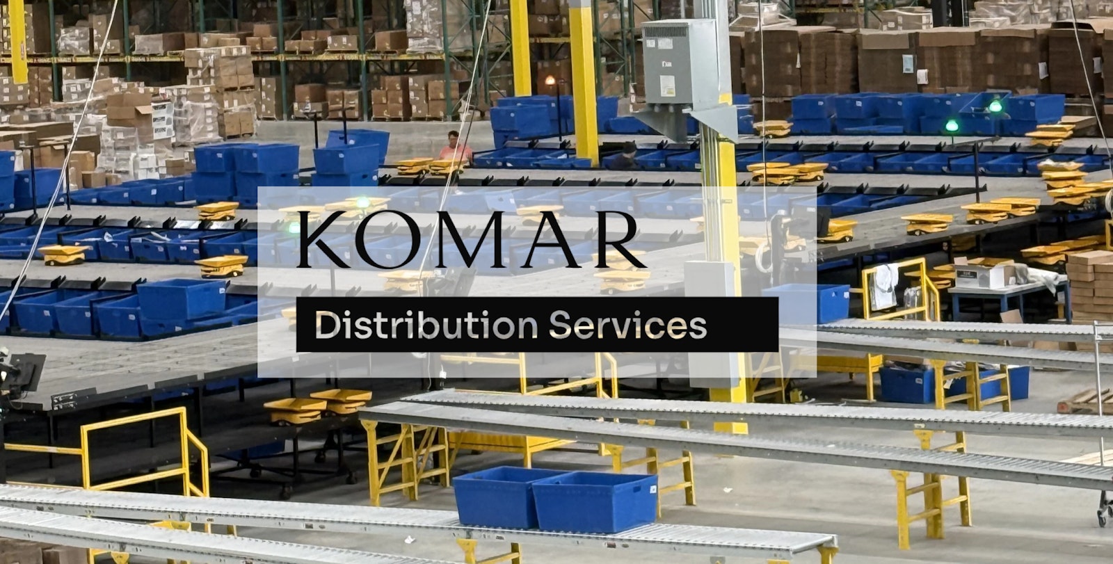 Komar Distribution Center with Komar logo