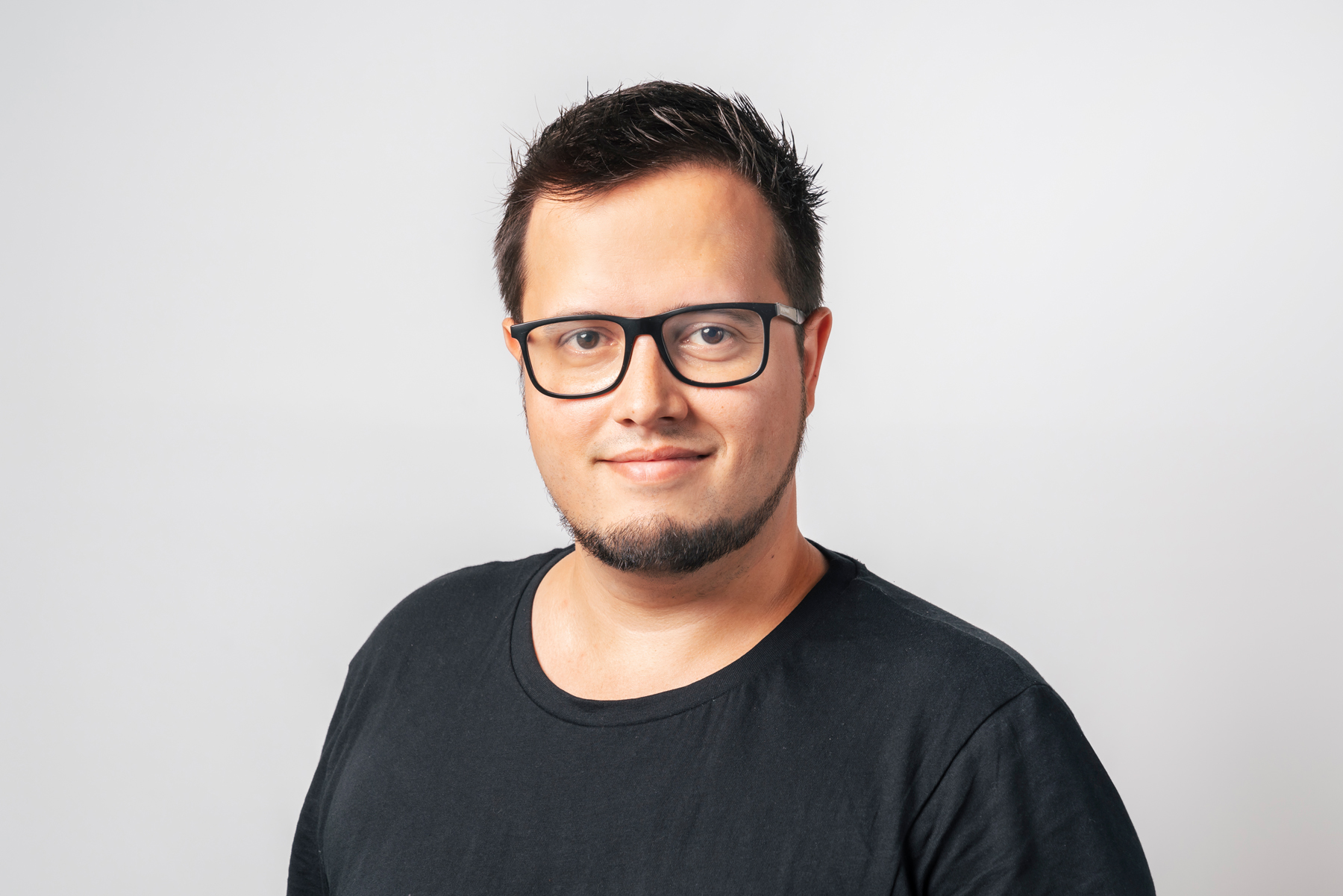 Portrait photo of a man in a black shirt