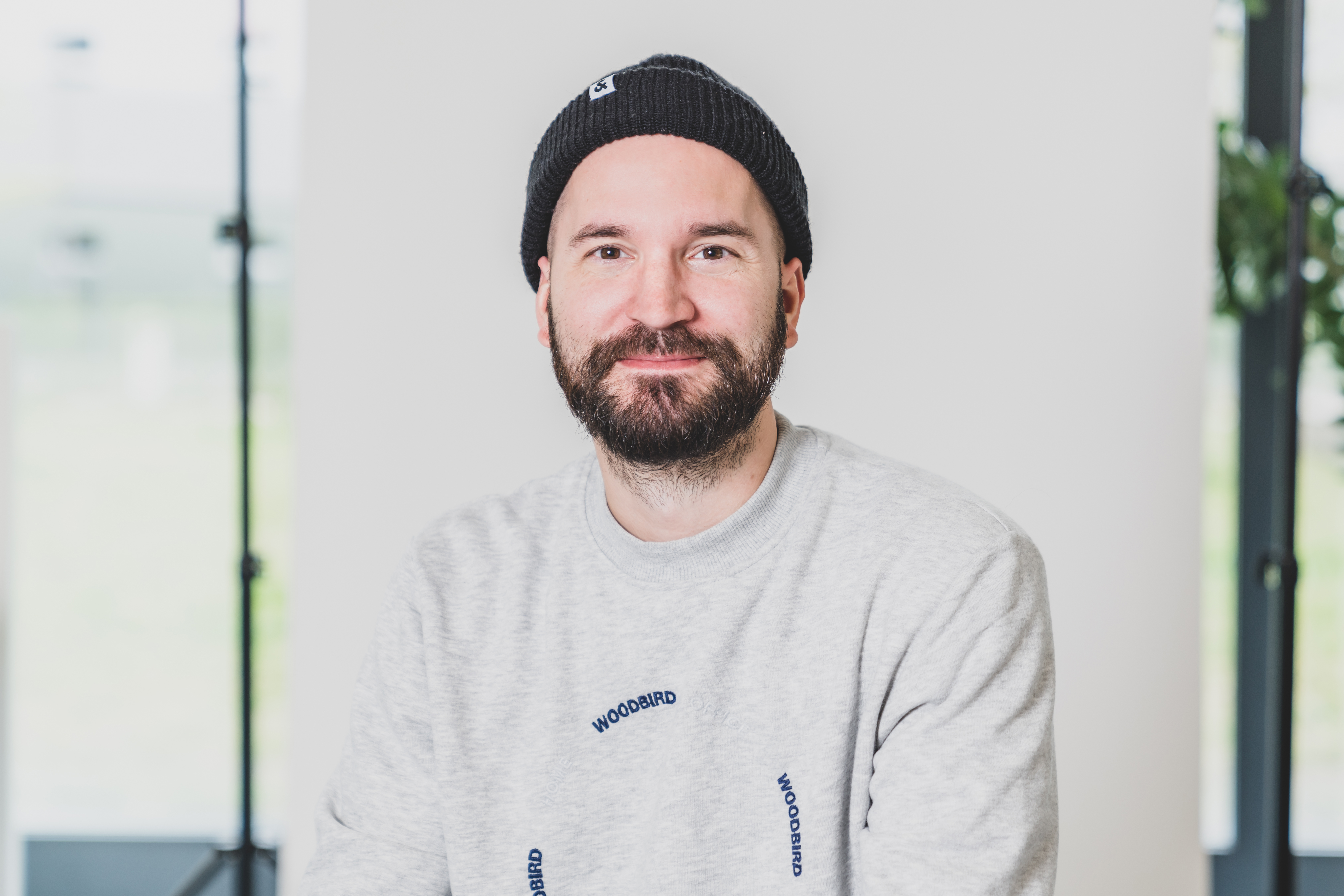 Portrait photo of a man in a grey shirt