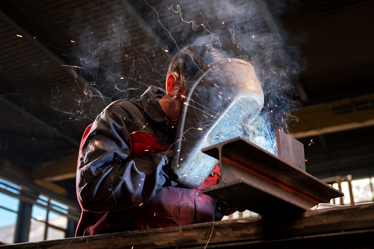 Welding steel A man welding steel