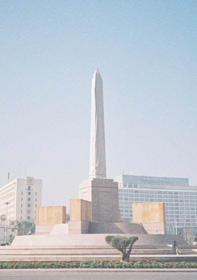 Recently installed in Tahrir Square in Cairo, and still not unveiled. The Surrounding sphinxes’ (still in crates) are relocated from Karnak, Luxor. This is all ostensibly to transform Tahrir Square into a major tourist attraction. But critics have also suggested that the move is designed to cover over the recent memory of the 2011 revolution with something historical that has no political connotations or significance…