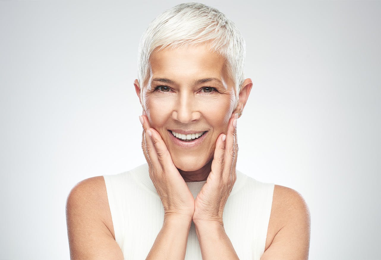 womens hands on cheeks