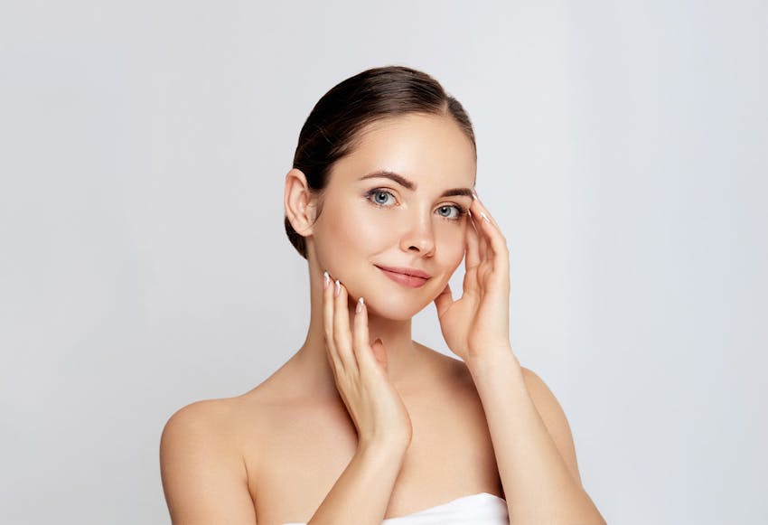woman with hands on face